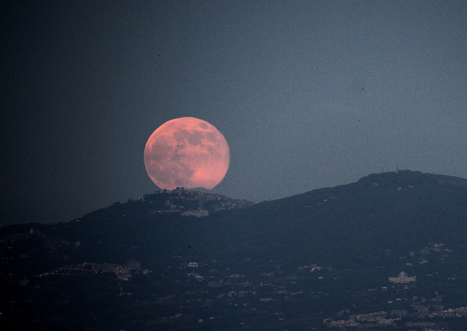 Strawberry moon rising over Rome